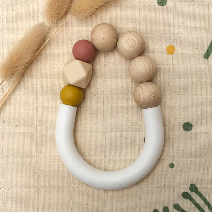 jouet de dentition pour bébé jaune terracotta en silicone alimentaire et bois